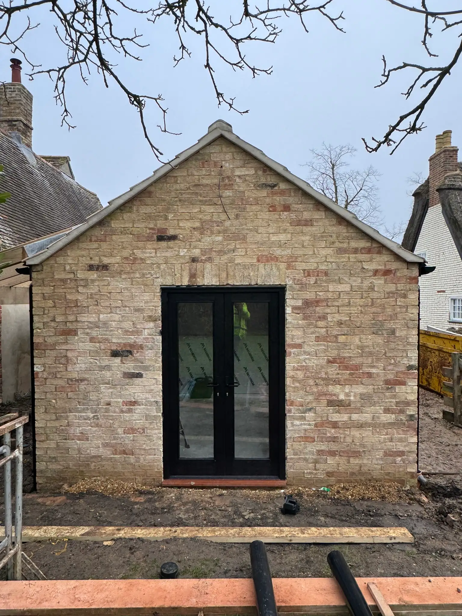 Rebuilt stone gable with new French doors